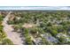 An aerial view that shows how the home is nestled within mature trees in a vibrant neighborhood at 1202 Chichester St, Orlando, FL 32803