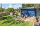 Spacious backyard with well-kept lawn, shed for storage, and cozy deck with patio seating at 1202 Chichester St, Orlando, FL 32803