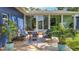 Outdoor space featuring a cozy seating arrangement on a wooden deck, surrounded by vibrant greenery at 1202 Chichester St, Orlando, FL 32803