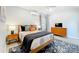 Bedroom with modern decor, a ceiling fan and an accent rug at 1202 Chichester St, Orlando, FL 32803