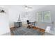 Well-lit bedroom with hardwood floors and a bright white paint with a large window to let in natural light at 1202 Chichester St, Orlando, FL 32803