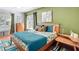 Bright bedroom with hardwood floors, a comfortable bed, and plenty of natural light from the windows at 1202 Chichester St, Orlando, FL 32803
