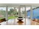 Dining room with natural light overlooking backyard with a deck and mature trees at 1202 Chichester St, Orlando, FL 32803