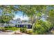 Charming blue single-Gathering home with well-maintained landscaping, mature trees, and a brick-paved driveway at 1202 Chichester St, Orlando, FL 32803