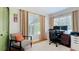 Bright home office with hardwood floors, large windows, and a stylish desk setup with ergonomic chair at 1202 Chichester St, Orlando, FL 32803