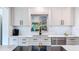 Bright kitchen with white subway tile backsplash, and stainless steel appliances at 1202 Chichester St, Orlando, FL 32803