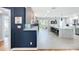 Spacious kitchen with gray cabinets, a marble island, and a tile backsplash with stainless steel appliances at 1202 Chichester St, Orlando, FL 32803