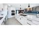 Open concept kitchen featuring a large island, stainless steel appliances, and pendant lighting at 1202 Chichester St, Orlando, FL 32803