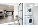 Convenient laundry area with a stacked washer and dryer, and a view into the rest of the house at 1202 Chichester St, Orlando, FL 32803