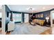 Cozy living room with dark accent wall, hardwood floors, and modern furniture at 1202 Chichester St, Orlando, FL 32803