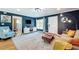 Well-lit living room with hardwood floors, modern decor, and white accents at 1202 Chichester St, Orlando, FL 32803