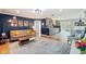Open-concept living area with modern decor, gray sofa, and seamless flow into the kitchen at 1202 Chichester St, Orlando, FL 32803