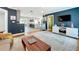 Bright living room with hardwood floors, modern decor, and an open view into the kitchen at 1202 Chichester St, Orlando, FL 32803
