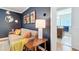 Cozy living room with stylish decor, a comfortable couch, and a glimpse into the adjacent bathroom at 1202 Chichester St, Orlando, FL 32803