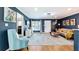 Inviting living room showcasing hardwood floors, contemporary decor, and seamless transition to kitchen at 1202 Chichester St, Orlando, FL 32803
