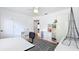 Bright office with hardwood floors, white storage, a rolling office chair, and a view to other rooms at 1202 Chichester St, Orlando, FL 32803