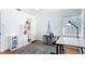 Bright, minimalist office with white walls, hardwood floors, white shelving, and two work spaces at 1202 Chichester St, Orlando, FL 32803
