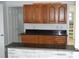 Kitchen features wood cabinets, stone counter tops and breakfast bar, seamlessly connecting to the living spaces at 1518 Indiana St, Orlando, FL 32805