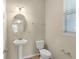 Bathroom featuring a pedestal sink, toilet, and neutral wall color at 16043 Pebble Bluff Loop, Winter Garden, FL 34787
