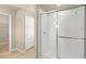 Bathroom features a large, bright tiled shower with glass doors at 16043 Pebble Bluff Loop, Winter Garden, FL 34787
