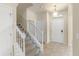Entryway with tiled floor, staircase, and white front door at 16043 Pebble Bluff Loop, Winter Garden, FL 34787