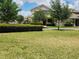 Exterior view showcasing the home's architectural style and surrounding landscaping at 16043 Pebble Bluff Loop, Winter Garden, FL 34787