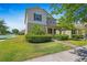 Inviting front exterior with lush landscaping, showcasing the home's curb appeal at 16043 Pebble Bluff Loop, Winter Garden, FL 34787