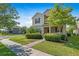 Inviting front exterior with lush landscaping, showcasing the home's curb appeal at 16043 Pebble Bluff Loop, Winter Garden, FL 34787