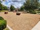 Playground with climbing rocks, slides, and spring riders, offering an engaging play area for children at 16043 Pebble Bluff Loop, Winter Garden, FL 34787