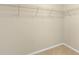 Spacious walk-in closet with carpeted floors and metal shelving units at 16043 Pebble Bluff Loop, Winter Garden, FL 34787