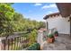 Outdoor balcony view overlooking lush green landscape, trees, and beautiful blue sky at 1716 Greystone Ct, Longwood, FL 32779
