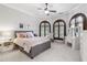 Beautiful bedroom with neutral paint, arched windows, and crown molding at 1716 Greystone Ct, Longwood, FL 32779