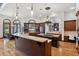 Large open kitchen featuring custom cabinets, granite countertops, and modern appliances at 1716 Greystone Ct, Longwood, FL 32779