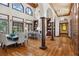 Grand living room with high ceilings, hardwood floors, and elegant architectural details at 1716 Greystone Ct, Longwood, FL 32779