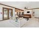 Spacious living room with trey ceiling, billiards table, hardwood bar, and lots of seating at 1716 Greystone Ct, Longwood, FL 32779