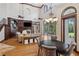 Open-concept living area with fireplace, dining area, and ample natural light at 1716 Greystone Ct, Longwood, FL 32779