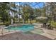 Inviting private pool with screened enclosure, water feature, and relaxing outdoor space at 1716 Greystone Ct, Longwood, FL 32779