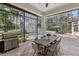 Outdoor patio area with a dining table, grill, and views of the pool at 1716 Greystone Ct, Longwood, FL 32779