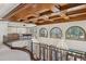 This upper level boasts decorative trey ceilings, chandeliers, arched windows, a bar, and a billiards room at 1716 Greystone Ct, Longwood, FL 32779