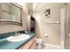 Bathroom with a round mirror, blue counter, and shower with curtain at 1718 Elaine Ave, Altamonte Springs, FL 32701