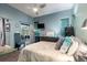 Light filled bedroom featuring a ceiling fan, a mounted TV, and access to the lanai at 1718 Elaine Ave, Altamonte Springs, FL 32701