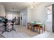 Bright eat-in kitchen featuring light-colored cabinets, stainless steel appliances, and a cozy breakfast bar at 1718 Elaine Ave, Altamonte Springs, FL 32701