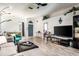 Well-lit living space with hardwood floors, a dining area, and an inviting entryway at 1718 Elaine Ave, Altamonte Springs, FL 32701