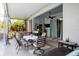 Screened patio with furnishings and a hot tub in the background at 1718 Elaine Ave, Altamonte Springs, FL 32701