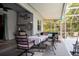 Covered patio with large table, chairs, and decor at 1718 Elaine Ave, Altamonte Springs, FL 32701