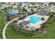 Aerial view of community pool, playground, and recreation area, providing a fun-filled atmosphere for families at 1909 Donahue Dr, Ocoee, FL 34761