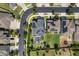 Overhead aerial view of a community with neatly arranged homes, manicured lawns, and solar panels on rooftops at 1909 Donahue Dr, Ocoee, FL 34761