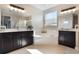 Bright bathroom featuring a soaking tub, large vanity, and walk-in shower at 1909 Donahue Dr, Ocoee, FL 34761