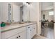 Double vanity in a bright bathroom with modern fixtures and ample counter space at 1909 Donahue Dr, Ocoee, FL 34761
