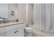 Well-lit bathroom featuring a single vanity and shower-tub combo at 1909 Donahue Dr, Ocoee, FL 34761